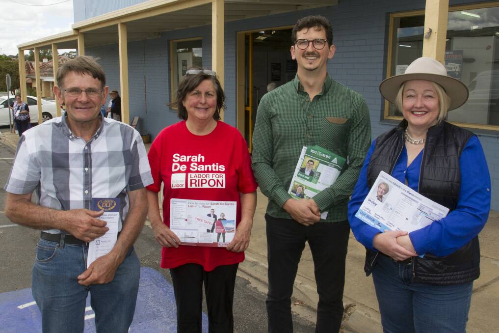 HARD AT WORK: Campaign workers Kevin Brady (DLP), Paula (Labor) and candidates Serge Simic (Greens) and Louise Staley (Liberals) at Stawell's early voting centre on Wednesday. Picture: PETER PICKERING