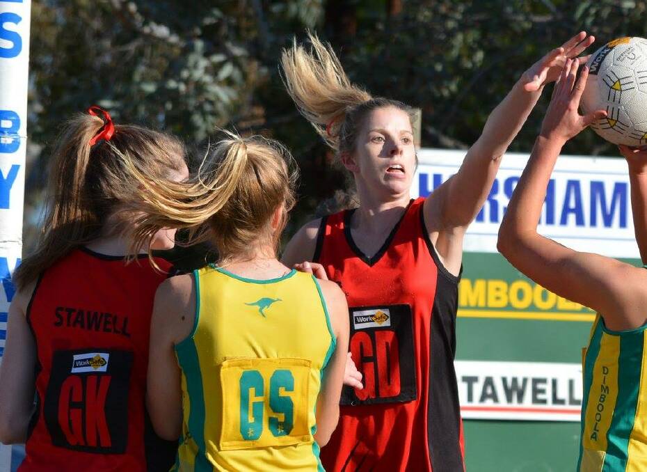 HANDS UP: Stawell defender Lisa Fleming does her best to stop a shot from Dimboola in the 51-47 loss in round 11 action at Dimboola.  Picture: Megan Warren. 