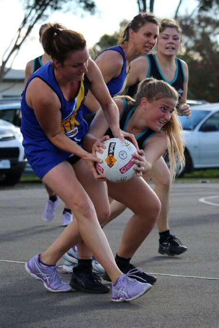 STRUGGLE: Drew Smith fights for the ball against Natimuk United. The Rams went on to win 55-34 and move to third on the HDFNL table. Picture: Trish Ralph. 