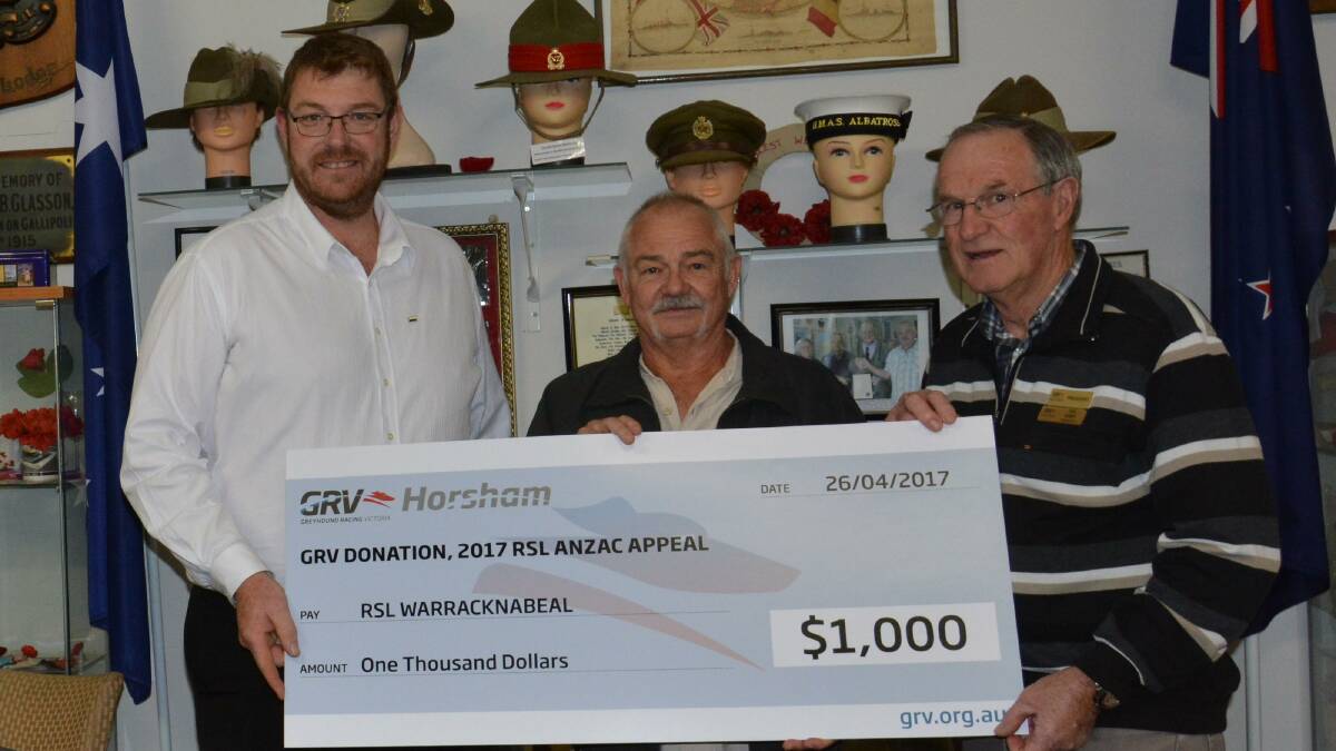 Horsham Greyhound Racing Club's Justin Brilliant and Ian Bibby present Warracknabeal RSL sub-branch president Jake Arnold, centre, with a cheque for $1000. 