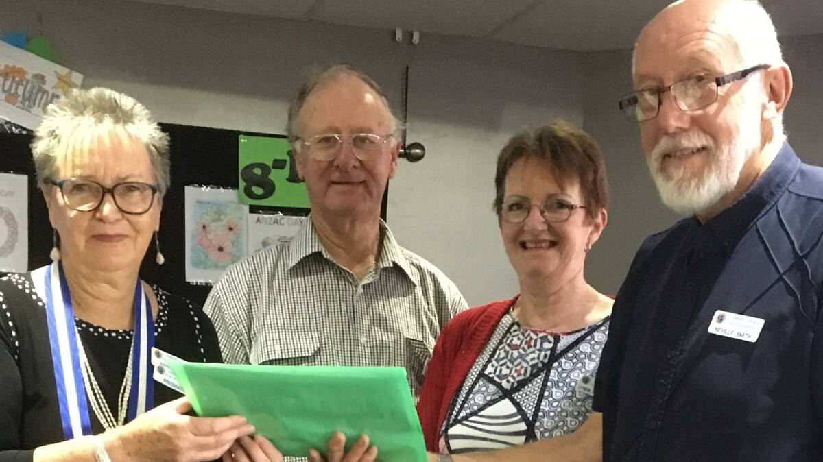 New Horsham Combined Probus president Faye Smith, left, made club history when she inducted husband Neville. Also inducted were Jim and Lynda Hutchinson, centre. 