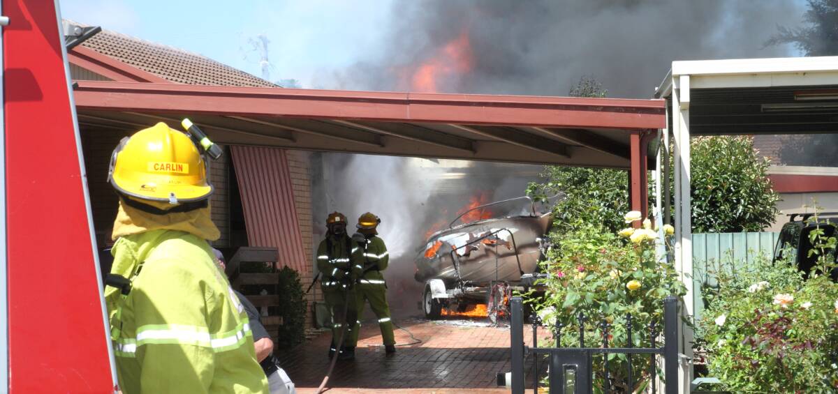 ABLAZE: A man refueling his boat turned disastrous after it caught fire beneath a carport and took Country Fire Authority crews 40 minutes to control. PICTURE: Peter Pickering