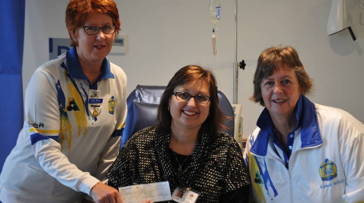 GENEROUS: Bowling Club president Ellen Werry (left) and member Kerry West (right) pass the cheque to Stawell Regional Health HR manager Janet Feeny.
