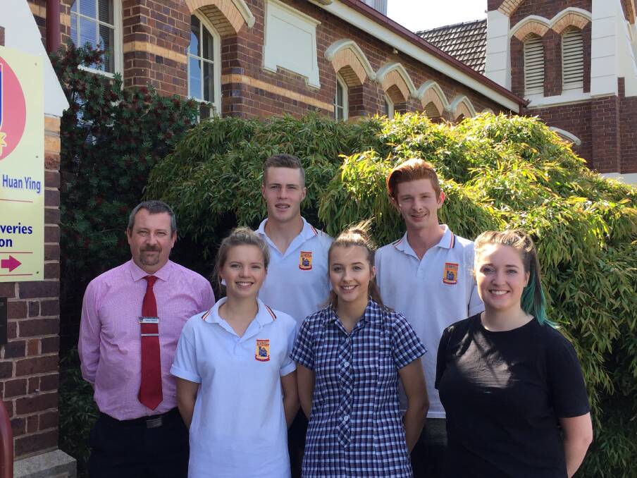 BIG YEAR AHEAD: Assistant principal Aaron Dalziel and VCE ccordinator Millie Francis with new school captains Jack Simmons, Nick Bendall, Julia Clugston and Monique Kennedy-Read. Picture: Anthony Piovesan
