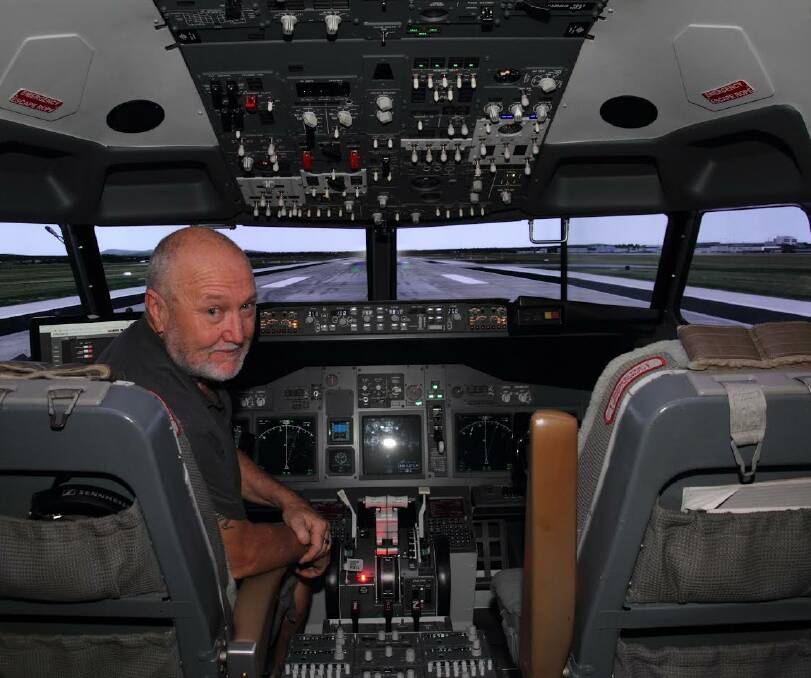 TAKE OFF: Pilot Brian Hamilton is ready to take guests on a virtual reality flight to any destination in the world. PICTURE: Peter Pickering