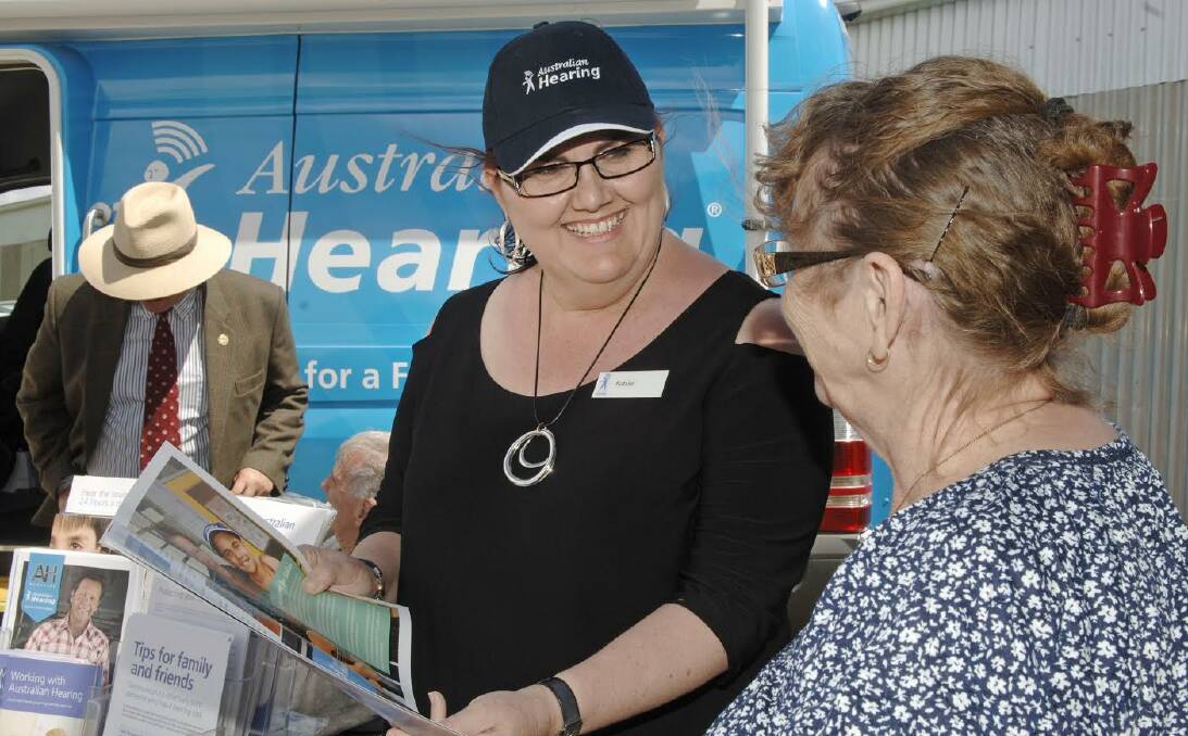 HEARING HEALTH: Australian Hearing Bus staff member provides information to a member of the public about the initiative's free hearing checks. The bus is set to be in Stawell from December 6-7. 
