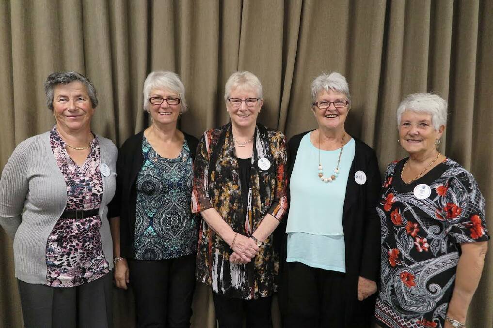 HAPPY: Newly inducted members Eva Fisher, Monica Fitzell, Carol Craig, Gaye Walter and Beryl Cox are welcomed into the group. 