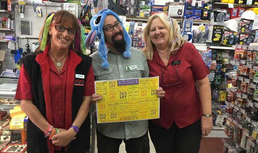 CRAZY BARGAINS: Lyal Eales manager Kerri Mansfield with Andy Chow and Debbie Phillips on one of their busiest days. Picture: Peter Pickering