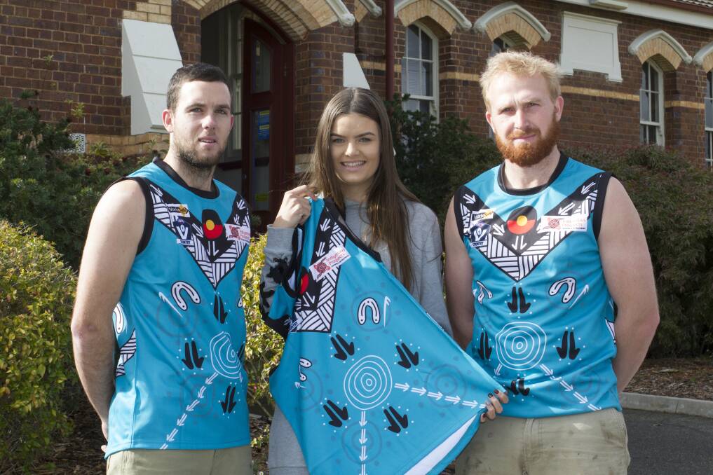 INDIGENOUS: Swifts coach Scott Carey and co-captain Nick Thomas with the artist of the Indigenous jumper, Heidi Chatfield. Picture: Peter Pickering 