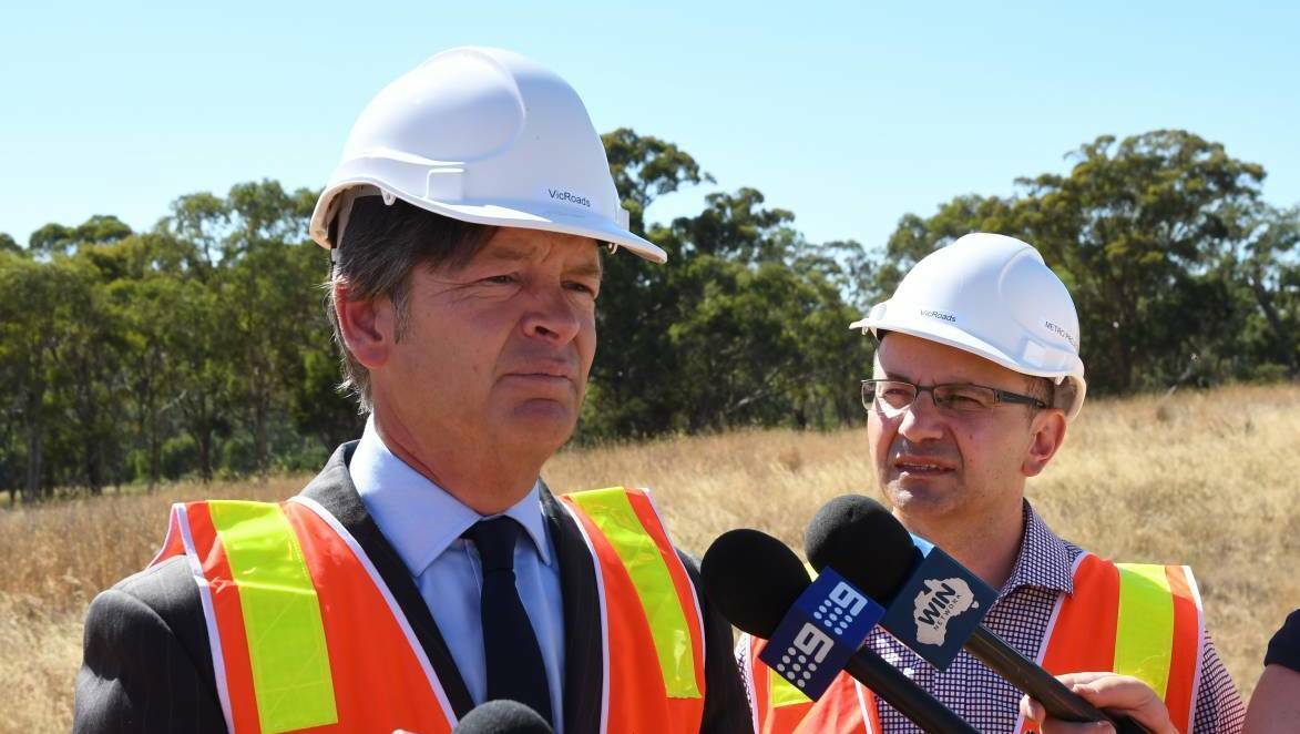Roads minister Luke Donnellan and VicRoads CEO Peter Todd believe wire rope barriers will reduce the road toll in country Victoria. Picture: ADAM HOLMES