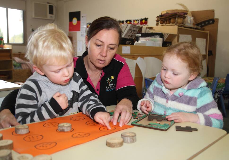 PROGRAM: Ararat Early Learning Centre director and kindergarten teacher Kerri Turner demonstrates a numeracy exercise to Jack and Hallie. Picture: PETER PICKERING