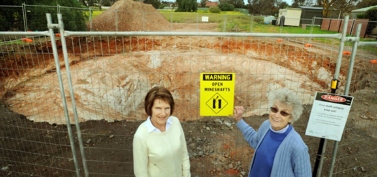 FILL-IN: Stawell residents Marg Hutton and Norma McIntyre are happy the mine shaft near Oriental Street will be filled in. Pictures: PAUL CARRACHER