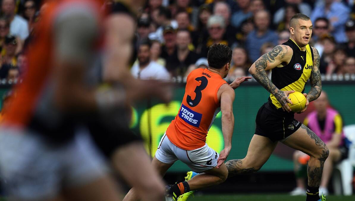 Dustin Martin of the Tigers is seen in action during the second AFL preliminary final between the Richmond Tigers and the GWS Giants at MCG in Melbourne on Saturday, September 23, 2017. PICTURE: AAP/Julian Smith)