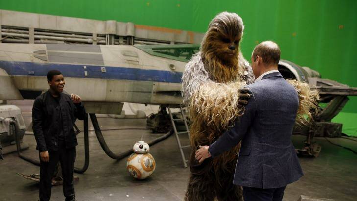 Don't you realise stormtroopers are the bad guys? Chewbacca gets to grips with Prince William on the set of Star Wars: Episode VIII. Photo: WPA Pool
