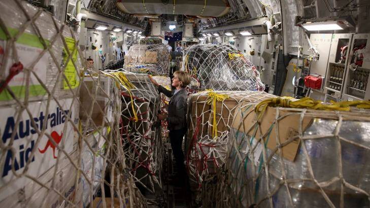 Foreign Affairs Minister Julie Bishop inspects Australian aid supplies on board a C-17 bound for Vanuatu on Sunday. Photo: Andrew Meares