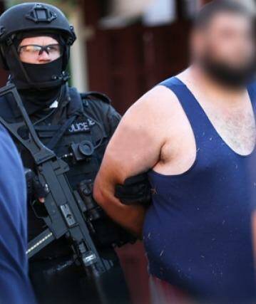 Omar Ammouche is arrested by police.  Photo: Supplied: NSW Police Media