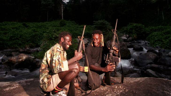 Two Bougainville Revolutionary Army soldiers during the fight for independence from Papua New Guinea in the late 1990s. Photo: Mike Bowers