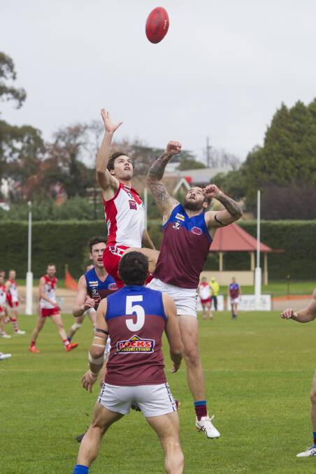 Xavier Vearing leaps high in a ruck contest during Saturday s clash against the Horsham Demons. Vearing was named Ararat s best player in the big loss. Picture: PETER PICKERING