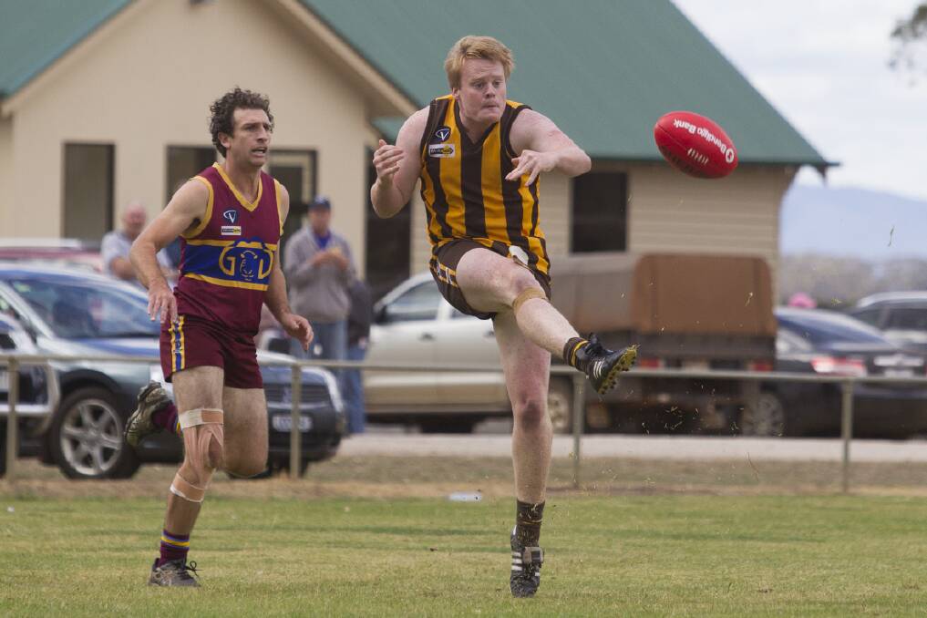 Tatyoon defender Jack Fraser drives the ball out of the backline during the Hawks big 80-point victory over Glenthompson/Dunkeld on Saturday. Pictures: PETER PICKERING