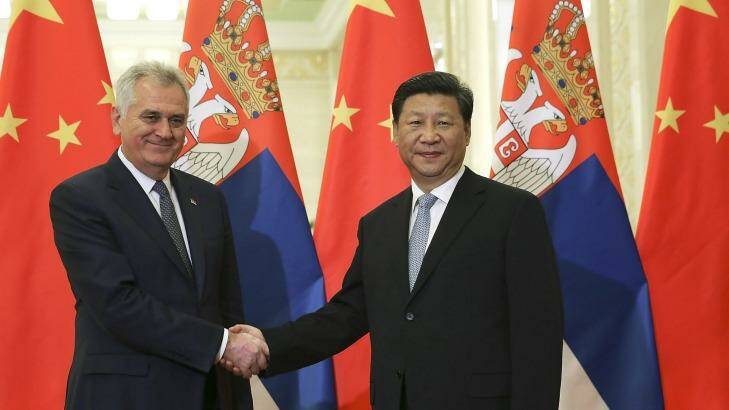 Serbian President Tomislav Nikolic, left, poses with Chinese President Xi Jinping in the Great Hall of the People in Beijing.  Photo: Lintao Zhang