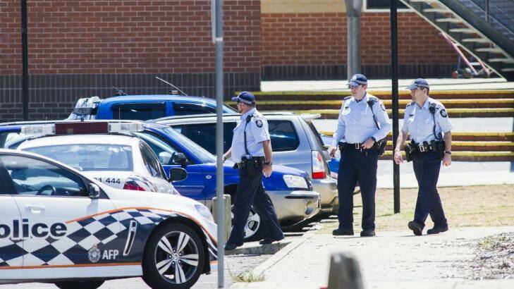 ACT Policing officers outside Lanyon High School on Tuesday following a bomb threat. Photo: Rohan Thomson