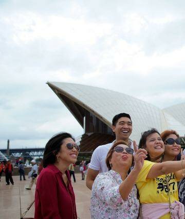 Tourists and selfie sticks: The latest craze in the emerging selfie economy. Photo: Wolter Peeters