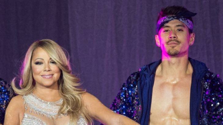 Mariah Carey on stage in London in March with back-up dancer Bryan Tanaka. Photo: Brian Rasic