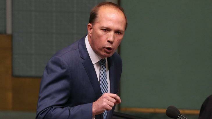 Immigration Minister Peter Dutton, pictured in Question Time on Monday, has called on Labor to reconsider its opposition to the refugee visa ban. Photo: Andrew Meares