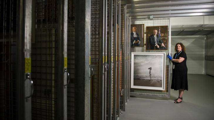 Art collection manager, Justine van Mourik with some of the hundreds of pieces of artwork stored beneath Parliament House. Photo: Rohan Thomson