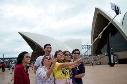 Tourists and selfie sticks: The latest craze in the emerging selfie economy. Photo: Wolter Peeters