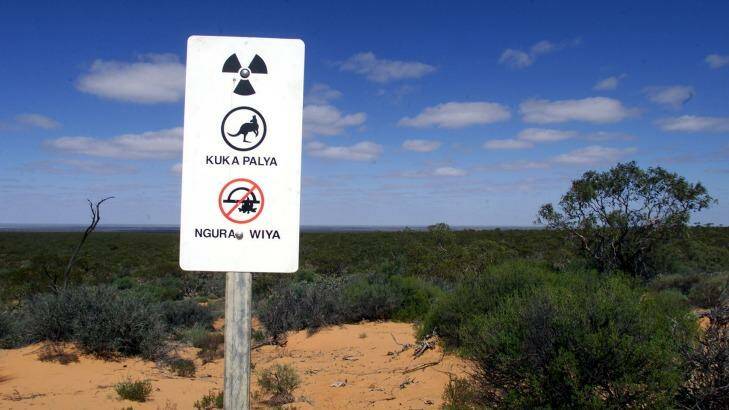 One of the warning signs erected at the former nuclear bomb testing site in the north-west of South Australia.   Photo: Bryan Charlton