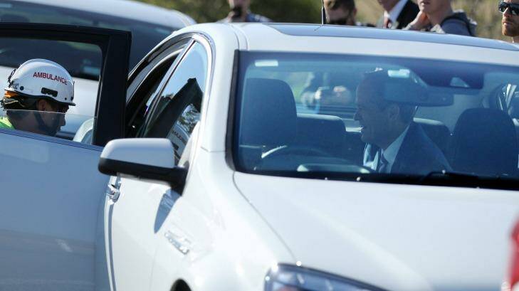 Bill Shorten comforts one of the drivers and her son in the back of his official car.  Photo: Max Mason Hubers