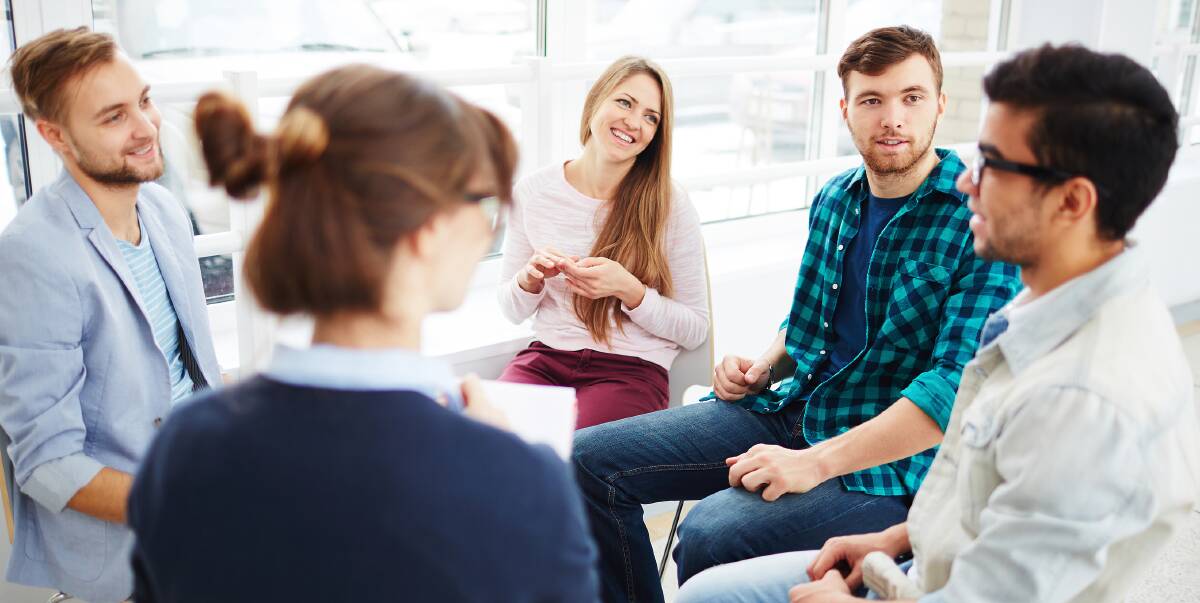 OFFERING SUPPORT: In the age of computers, group meetings and one-on-one interactions are still important for people experiencing mental health issues. 