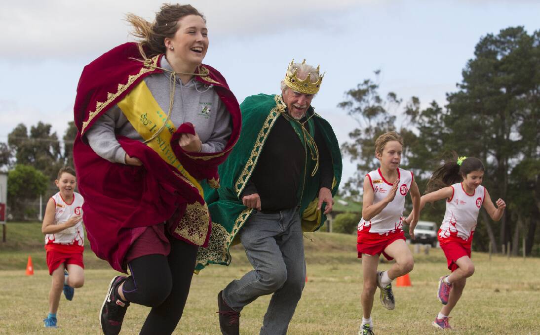 A ROYAL RACE: Royals of the 2015 Golden Gateway Festival, Queen Zara Thompson and Bryan Kennedy join in the fun with Little Athletics. Picture: PETER PICKERING. 