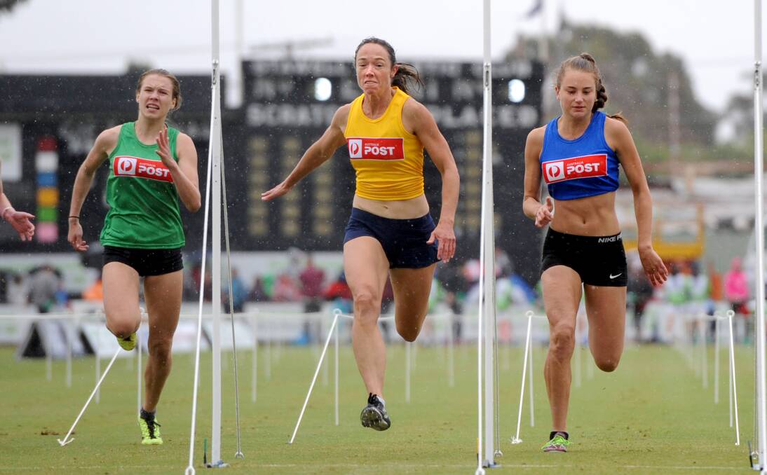 STRONG WOMEN'S COMPETITION: Lynette Viney, yellow, in action winning the third semi in the Australia Post Strickland Family Women's Gift in 2015. Picture: SAMANTHA CAMARRI