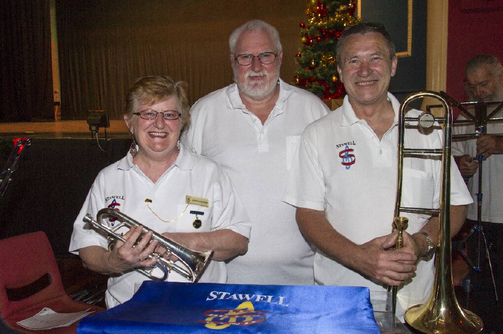 PLAYING ON: In 2015, Stawell City Brass Band members Josie Joynson, Mark Smith and Wayne Collins provided music for carols. Picture: PETER PICKERING


