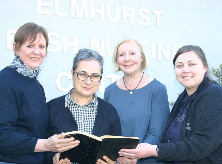 COMMEMORATIVE BOOK: Centre manager Alison Oliver with board members Dr Robyn Wood, Christine Bairnes and Carolyn Macdonald with a historic diary. 