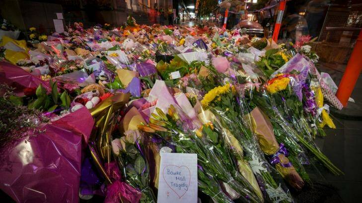 Floral tributes line Bourke Street Mall. Photo: Eddie Jim
Click photo to read - 'He grabbed my hand': The unsung story of a Bourke Street attack hero