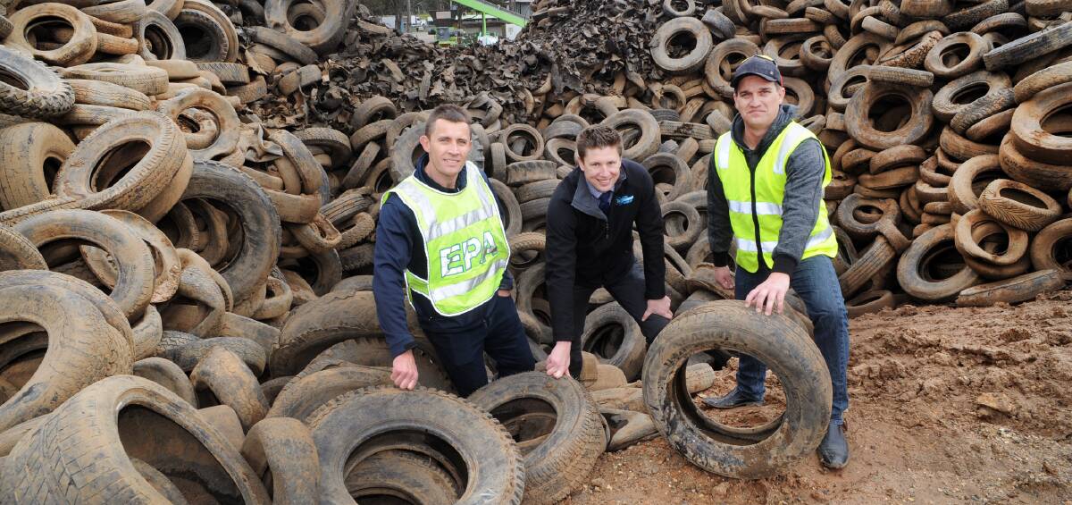 RED TAPE:  EPA's Danny Childs, Northern Grampians Shore chief executive Michael Bailey, and Used Tyre Recycling Corporation's Joel Knibbs, at Stawell tyre dump. Picture: PAUL CARRACHER 