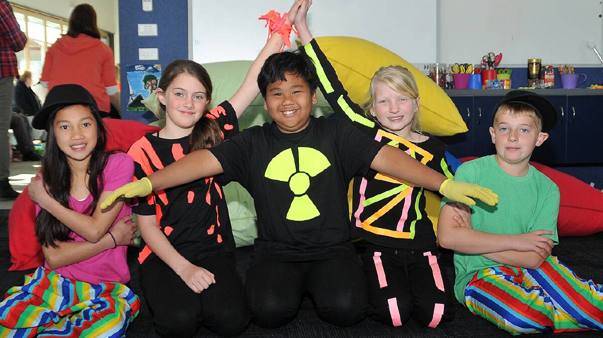 Stawell West Primary School students presented the fi rst of their two school concerts last night at the Stawell Entertainment Centre and will be back tonight
for their encore performance. The concerts feature a theme based around the four elements of water, air, earth and fi re, with each class putting on an act.
Pictured in their costumes ready to perform again tonight are L-R Jessa, Ellie, Lei, Elizabeth and Oscar. Picture: KERRI KINGSTON.