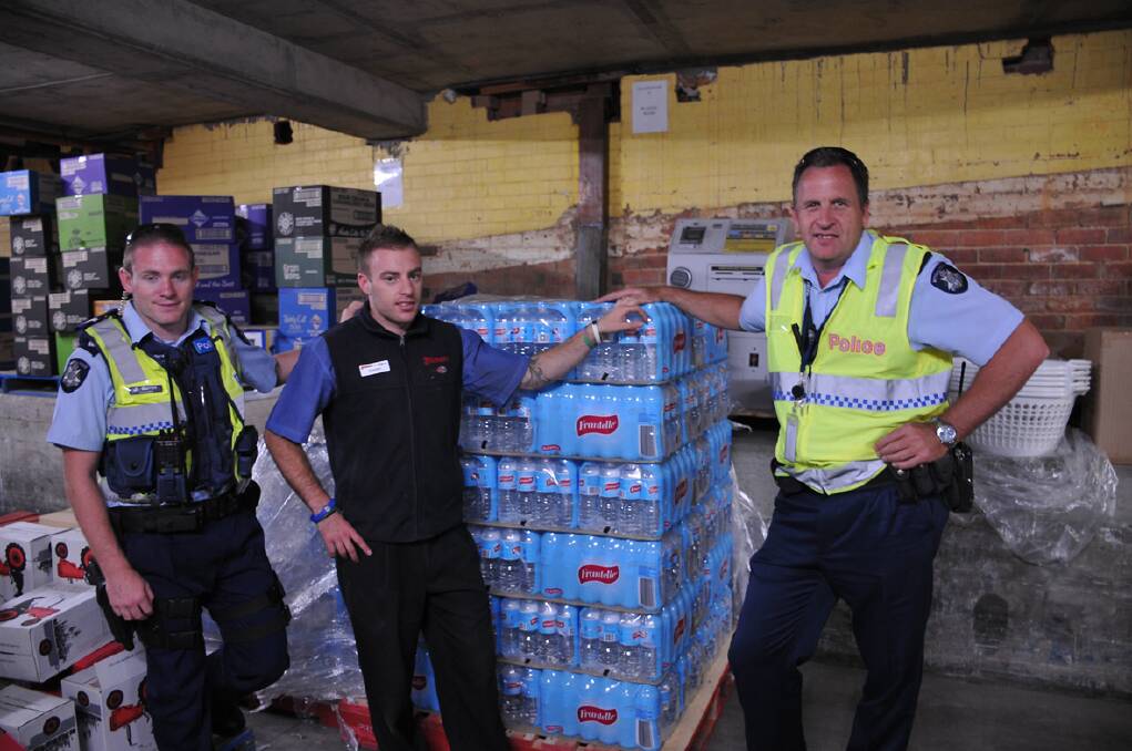 Fishers IGA Assistant Manager Damien Smith (centre) with Stawell Police Constables Nathan Warren (left) and Carl Burmester (right). Picture: BEN KIMBER.