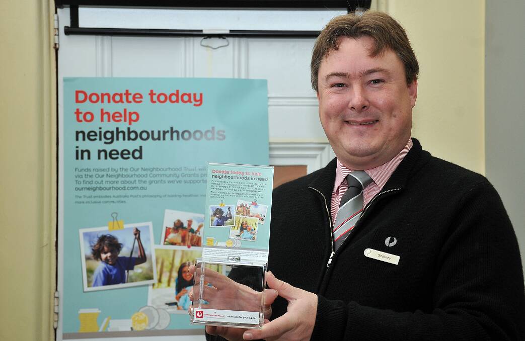 Scotney Hayter with one of the donation boxes at the Australia Post Stawell Post Shop. Picture: KERRI KINGSTON.
