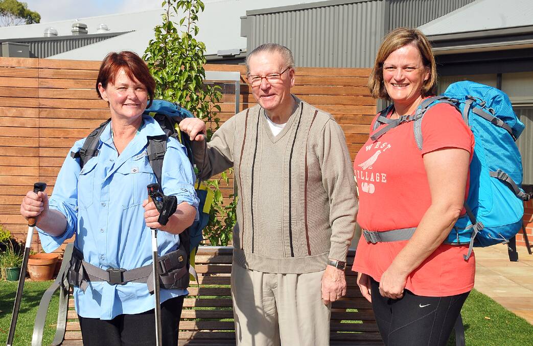 Leeanne Nuske (left) and Andrea Monaghan (right) with Eventide Homes resident Syd Gregory, prepare for their walk in Spain. Picture: KERRI KINGSTON