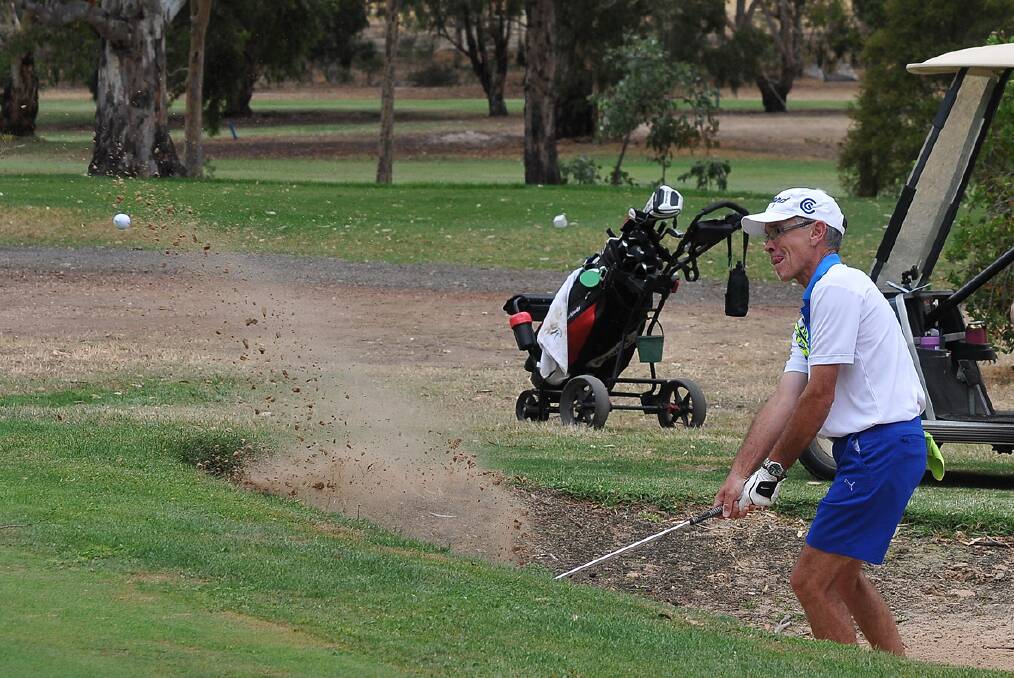 A grade winner Max Waters chips his ball out of the bunker during his round of the Stawell Golf Club's stableford event. Picture: MARK McMILLAN.