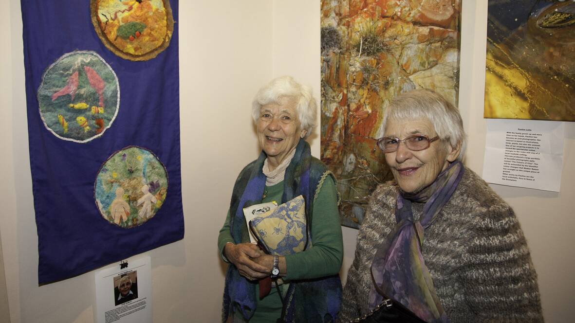 Margot Sietsma (left) and Joyce Matheison admire Joyce’s textile works in the Rallway Gallery exhibition. Picture: JOHN TIDDY.