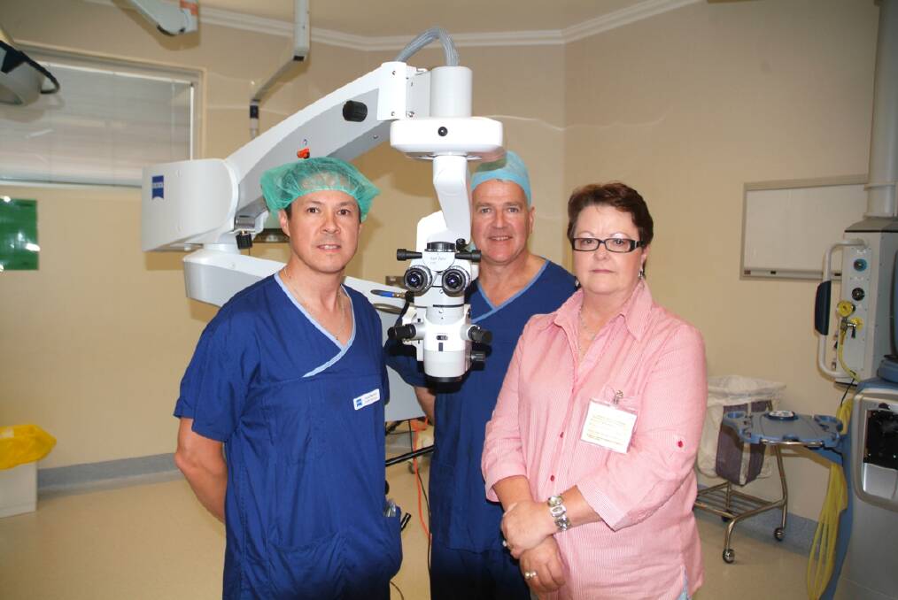 (L-R) Zeiss Product specialist Jason Hurnall, Dr Michael Toohey and Dianne Burton with the Lumera Eye microscope. Picture: BEN KIMBER.