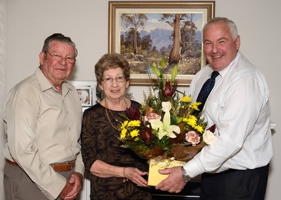 Hartley and Eline Beelitz, celebrating their 60th Wedding Anniversary receive flowers from Northern Grampians Shire Mayor, Cr Kevin Erwin (right).