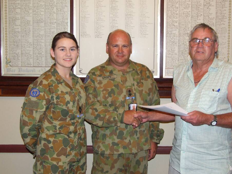 Stawell RSL Branch president Geoff Reading (right) presents the $6,100 cheque to Cadet Under Officer Taya Croft (left) and Lt Aaron Croft (centre).