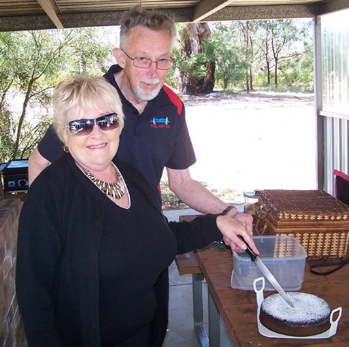 Maureen and John Knight cutting the Stawell Yacht Club 60th anniversary cake. Picture: TONY HILLIER.
