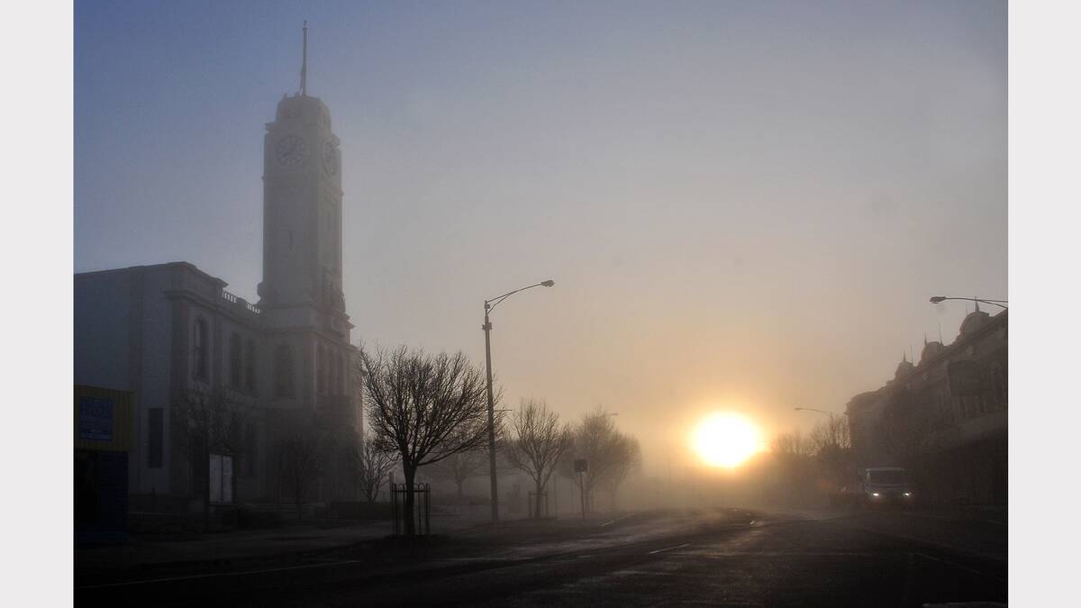 The sun starts to break its way through the thick fog that blanketed Stawell early this morning. The photograph was taken looking up Main Street. PICTURE - KERRI KINGSTON.